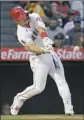  ?? Associated Press ?? Mark J. Terrill MIKE TROUT hits a two-run homer during the third inning.