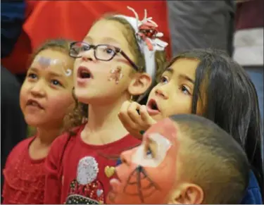  ?? FILE PHOTO ?? Kids watched with excitement as a magic show was performed at North End Fire Company during the 31st annual holiday party for foster children.