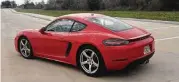  ?? Jeff Yip photo ?? The 718 Cayman’s Porsche logotype is now chrome against a black accent strip that integrates with the spoiler. The central positionin­g of the exhaust is retained.