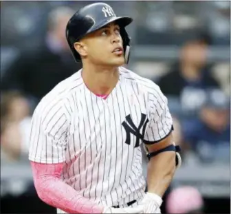  ?? KATHY WILLENS — THE ASSOCIATED PRESS ?? Yankees designated hitter Giancarlo Stanton watches his fifth-inning, solo home run in a game against the Oakland Athletics on Sunday.