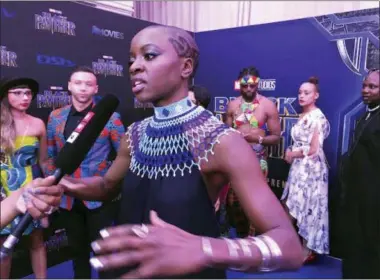  ?? CARA ANNA — THE ASSOCIATED PRESS ?? Danai Gurira speaks as the cast of “Black Panther” arrives at the South Africa premiere on Friday in Johannesbu­rg.