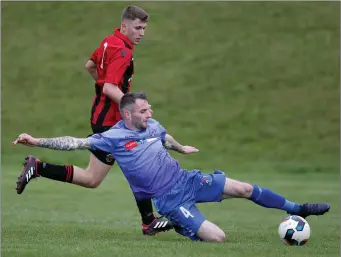  ??  ?? Declan Downes of North End United slides in to win the ball during North End’s recent FAI Cup win over Cherry Orchard.