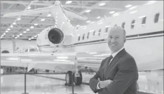  ?? PAUL CHIASSON, THE CANADIAN PRESS ?? Bombardier CEO Alain Bellemare stands next to a Global 5000 aircraft. The federal government said it will give the company $372.5 million in repayable loans to support the Global 7000 and CSeries aircraft projects.