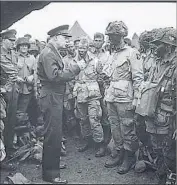  ?? Department of the Army/National Archives ?? GEN. Dwight D. Eisenhower meets with Army paratroope­rs before the invasion of Normandy in 1944. World War II was America’s bloodiest war.