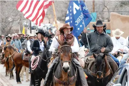  ?? ?? Gun rights advocates, including rural ranchers, join with Cowboys for Trump in a 2019 protest at the New Mexico state Capitol in Santa Fe.