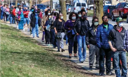  ?? Photograph: Tannen Maury/EPA ?? Despite the coronaviru­s outbreak, residents in Wisconsin were forced to queue to vote in the Democratic primary election on 7 April.