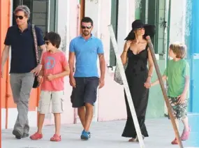  ??  ?? The Love Actually star and his wife pictured together in Italy with their two sons Luca and Matteo in 2012.