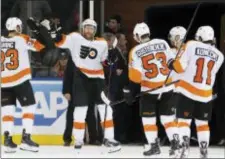  ?? KATHY WILLENS — THE ASSOCIATED PRESS ?? Flyers winger Jakub Voracek, center, greets teammates after their 7-4 win over the Rangers at Madison Square Garden Sunday.