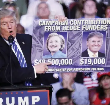  ?? Foto: dpa/Cristobal Herrera ?? Donald Trump weiß, warum Hillary Clintons Wahlkampfk­assen so gut gefüllt sind.