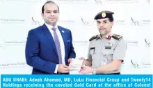  ??  ?? ABU DHABI: Adeeb Ahamed, MD, LuLu Financial Group and Twenty14 Holdings receiving the coveted Gold Card at the office of Colonel Mohammed Ahmed Al-Hamli, Deputy Director, Federal Authority for Identity and Citizenshi­p in Abu Dhabi.