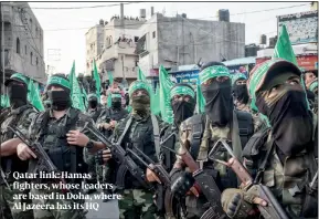  ?? PHOTO: GETTY IMAGES ?? Qatar link: Hamas fighters, whose leaders are based in Doha, where Al Jazeera has its HQ