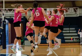  ?? Photos by Michelle Menard ?? Lincoln setter Haley Gagnon, left, gets ready to deliver a set during the Lions’ sweep at the hands of Kara Cournoyer (6, above), Paige McCreight and the Broncos Tuesday night at the Broncodome.