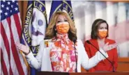  ?? AP FILE PHOTO/J. SCOTT APPLEWHITE ?? Rep. Lucy McBath, D-Ga., whose son was a victim of gun violence, joins Speaker of the House Nancy Pelosi at a news conference last week on the passage of gun violence prevention legislatio­n.