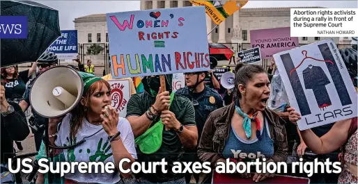  ?? NATHAN HOWARD ?? Abortion rights activists during a rally in front of the Supreme Court