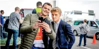  ?? AFP ?? Ajax’s Kasper Dolberg (right) poses for pictures at Schiphol Airport before the team’s departure to Stockholm. —