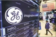  ?? Richard Drew / Associated Press ?? General Electric says it will take a $6.2 billion after-tax charge in the fourth quarter tied to its review and reserve testing of GE Capitals run-off insurance portfolio.