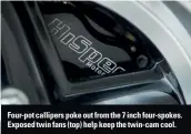  ??  ?? Four-pot callipers poke out from the 7 inch four-spokes. Exposed twin fans (top) help keep the twin-cam cool.