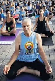  ?? PHOTO: REUTERS ?? Balanced exercise . . . People practise yoga on Internatio­nal Yoga Day in Tel Aviv, Israel.