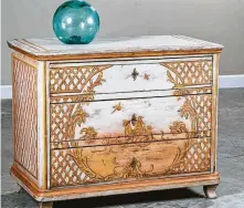  ?? Courtesy of Carl Moore Antiques ?? This antique German Biedermeie­r painted chest of drawers at Carl Moore Antiques was made around 1830 in a rococo design.