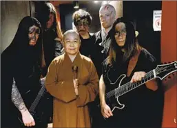  ??  ?? BUDDHIST NUN Miao Ben and her Dharma bandmates, at a rehearsal in Taipei, chant mantras in Sanskrit during shows to maintain authentici­ty.