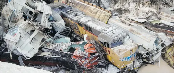  ??  ?? A serpertine wreckage is all that remains of a Canadian Pacific freight train after a derailment near Field. Investigat­ors say the train, which had 112 cars and three locomotive­s, gained speed well in excess of the 32 km/h maximum for the tight turns in a mountain pass.