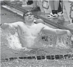  ?? GEOFF BLANKENSHI­P/COLUMBUS DISPATCH ?? William Harpster celebrates a Division II state title for Columbus Academy in the 200 free relay Friday in Canton.