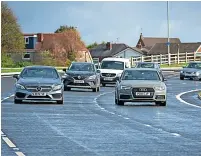  ?? Rochdale council ?? ●●The first cars on new South Heywood link road, Queen Elizabeth Way.