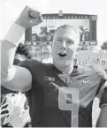  ?? CHARLES REX ARBOGAST/AP ?? Illinois quarterbac­k Artur Sitkowski celebrates the team’s 30-22 win over Nebraska.