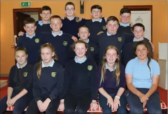  ??  ?? 6th Class pupils who graduated from Meelin National School.
Above right: Darren McCarthy receiving the Hurling Award.
Right: Caoimhe Shine receiving the Loyalty Award from Teacher Moira O’Connor.