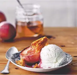  ??  ?? Roasted White Peaches with Honeycomb and Vanilla Ice Cream.