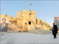  ?? Picture: REUTERS ?? WAR OF CONQUEST: A street vendor sells coffee outside Aleppo's ancient citadel. Syria's President Bashar al-Assad has vowed to defeat the Islamic State insurgents