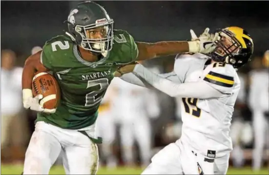  ?? JOHN BLAINE — FILE PHOTO — FOR THE TRENTONIAN ?? Steinert’s Jordan Morrison, left, had a hand in five touchdowns on Saturday, but the Spartan’s rally from 28 points down came up just short against Wall.