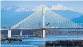  ?? MARK VAN MANEN/PNG FILES ?? The tolled Port Mann Bridge stands out against snow-covered mountains in December 2014.