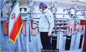  ?? Photograph: Anadolu Agency/Getty Images ?? An engineer tests equipment during an Iranian state broadcast announcing the start-up of uranium enrichment centrifuge­s at the country’s Natanz facility.