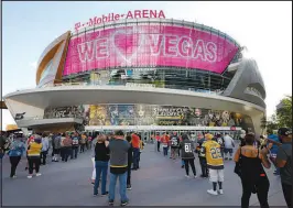  ??  ?? Vegas Golden Knights fans wait May 18 to enter T-mobile Arena for Game 2 of Vegas’ Stanley Cup playoff series against the Minnesota Wild. As COVID-19 capacity restrictio­ns are eased and lifted, venues such as T-mobile will be able to play host to capacity crowds again.