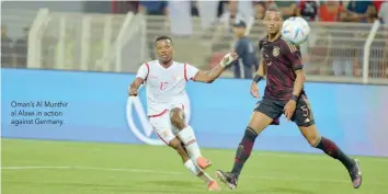  ?? Oman’s Al Munthir al Alawi in action against Germany. ??