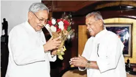  ?? PTI ?? HAM (S) chief Jitan Ram Manjhi greets Bihar Chief Minister Nitish Kumar at his official residence in Patna on Tuesday