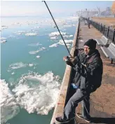  ?? ERIC SEALS, DETROIT FREE PRESS ?? Rising levels of mercury after years of declines could be a worry for fishermen such as Ronnie Gotcher, 59, of Detroit.