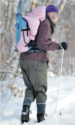  ?? JOHN LUCAS/ EDMONTON JOURNAL ?? Martin Jagersand skis through Emily Murphy Park on Thursday with his daughter Lena on his back.