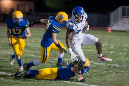  ?? PHOTO SERGIO BASTIDAS ?? Central Union High’s Skylar Cook attempts to run the ball during the 2021 Bell Game against Brawley Union High on Friday night in Brawley.