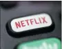  ?? JENNY KANE — THE ASSOCIATED PRESS ?? Netflix is raising most of its U.S. prices by 8% to 13% as its video streaming service rides a wave of rising popularity spurred by government-imposed lockdowns that corralled people at home during the fight against the pandemic.