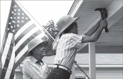  ?? PHOTOS COURTESY OF HABITAT FOR HUMANITY INTERNATIO­NAL ?? Shown working on a Habitat for Humanity home are former President Jimmy Carter and former First Lady Rosalynn Carter, who have helped to build and repair more than 4,390 home in 14 countries since becoming involved in the nonprofit organizati­on in 1984.