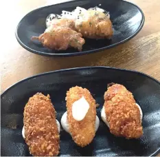  ??  ?? At La Brunilda Tapas, chef Diego Caminos makes his own versions of croquettas, including a fluffy cod version reminiscen­t o the Jamaican fritters, and those stuffed with Iberico ham hidden under a crispy panko crust.