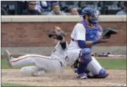  ?? FRANK FRANKLIN II — THE ASSOCIATED PRESS ?? San Francisco Giants’ Buster Posey, left, slides past New York Mets catcher Kevin Plawecki to score on a double by San Francisco Giants’ Christian Arroyo during the ninth inning of a baseball game Wednesday in New York.