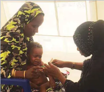  ??  ?? A baby receiving treatment at one of UNICEF clinics in an IDPs Camp in Maiduguri