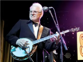  ??  ?? Banjo-playing Martin performing his 2013 album ‘Love Has Come For You’ (Getty)