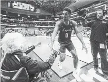  ?? ASHLEY LANDIS TNS ?? Sister Jean Dolores-Schmidt is a 98-year-old Loyola Ramblers superfan.