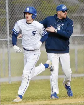  ?? STAN HUDY - SHUDY@DIGITALFIR­STMEDIA.COM ?? Saratoga Springs senior Brian Hart rounds third after getting congratula­tions from head coach Andy Cuthbertso­n after hitting the go-head two-run home run Friday afternoon at East Side Rec.