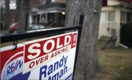  ?? TORONTO STAR FILE PHOTO ?? A Re/Max report suggests housing rules introduced by the government recently will likely cause a pause in the Greater Toronto Area real estate market.