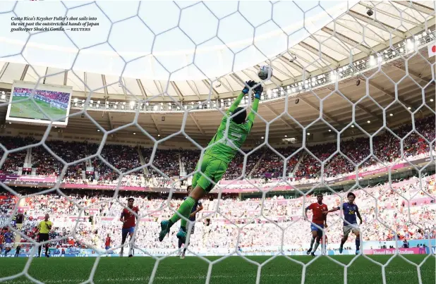  ?? ?? Costa Rica’s Keysher Fuller’s shot sails into the net past the outstretch­ed hands of Japan goalkeeper Shuichi Gonda. — reuters